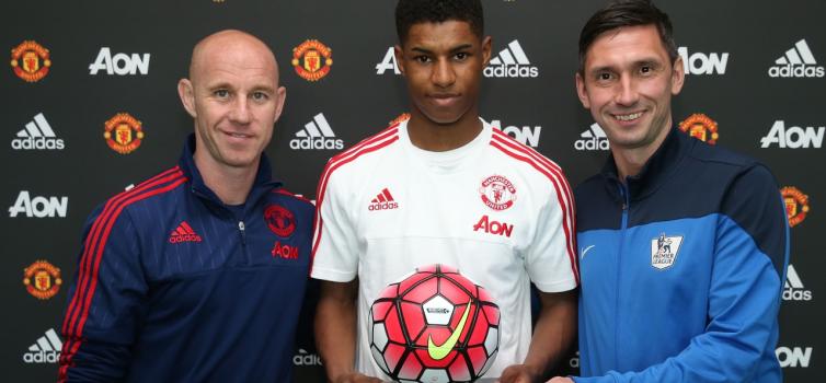 Marcus Rashford receives an award after graduating to Man Utd's first team