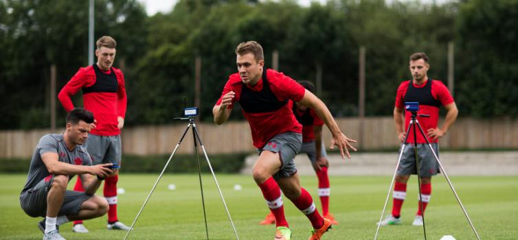 Tom Henson (left) monitors players during their sprint tests