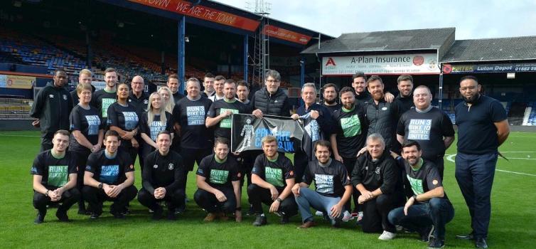 Luton Town staff have rallied to support Mick Harford (centre)