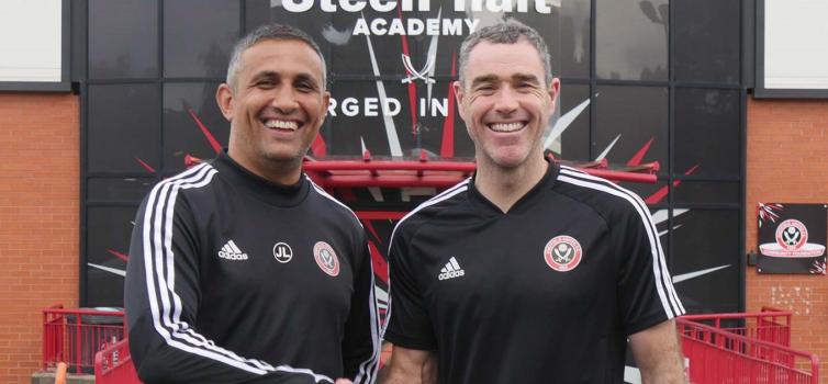 Hughes (right) with Academy Manager Jack Lester