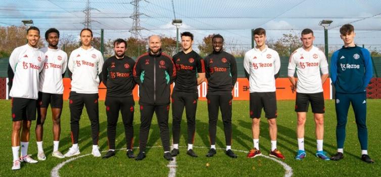 Left to right: Academy alumni Joe Thompson, Matthew Olosunde, Tom Thorpe. Staff Ethan Heseltine (Assistant Academy Analyst), Neil Harris (Academy Coach), Joel Fletcher (Academy Goalkeeper Coach), Andrew Laylor (Academy Player Support Co-Ordinator). And Academy alumni Callum Gribbin, Oli Kilner and Eric Hanbury.