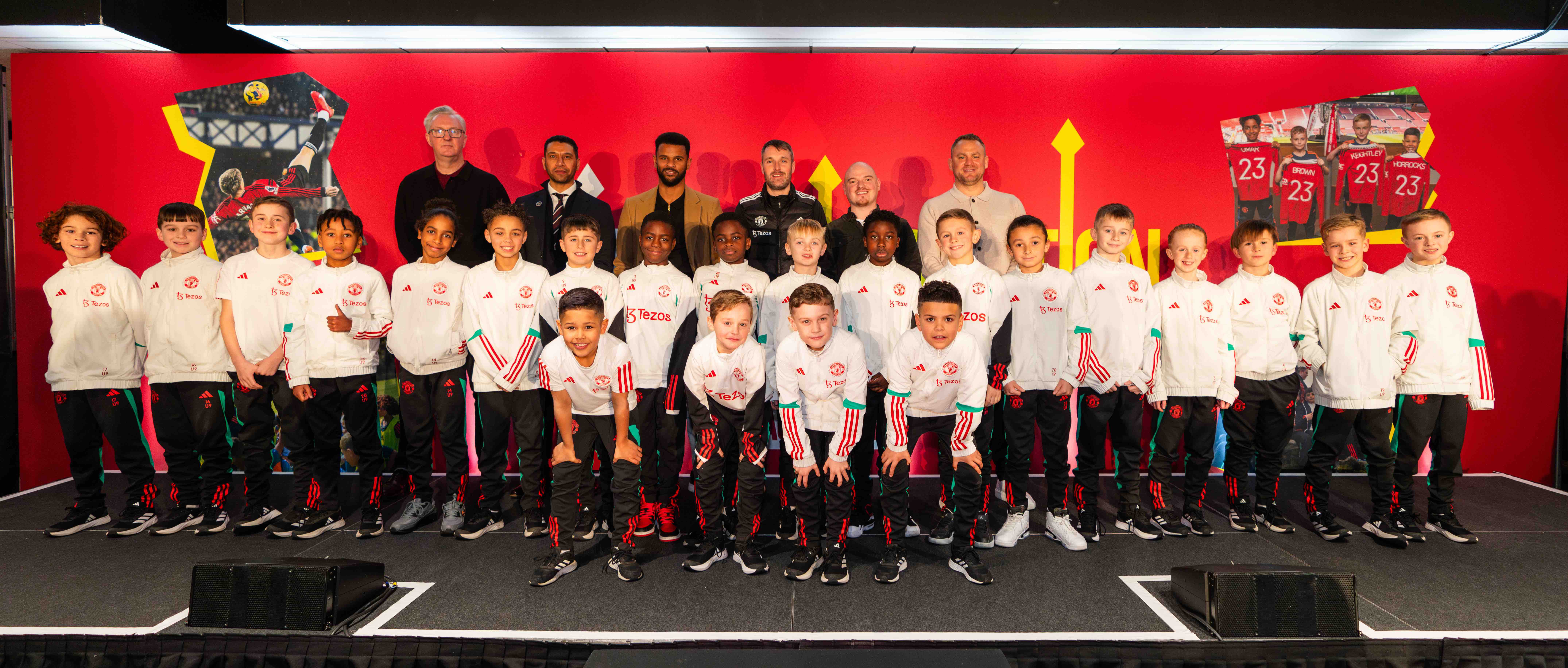 Back row: Tony Walsh (poet), David Rainford (Head of Education & Academy Player Care, Premier League), Fraizer Campbell (former Man Utd player), Nathan McConville (Foundation Phase Lead, Man Utd, James Wilcock (Foundation Phase Lead, Man Utd) and Eddie Johnson (Academy Support Manager, Premier League)