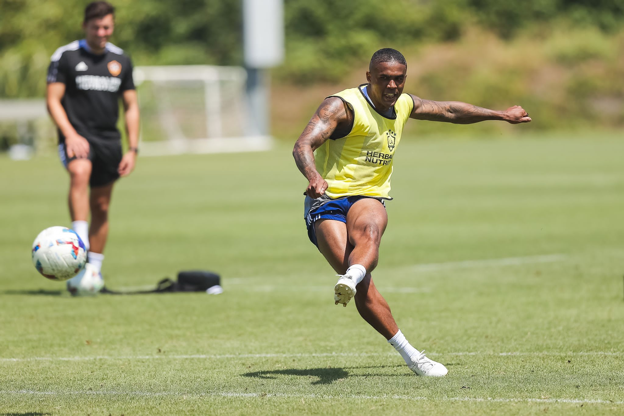 Brazil international Douglas Costa (training with Green watching on) is one of Galaxy's star players. He previously played for Bayern Munich and Juventus,